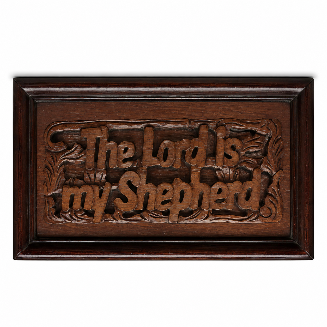 A rectangular hand-carved wooden plaque with a dark brown finish, featuring the carved text 'The Lord is my shepherd' in a stylized font, set against a plain white background.